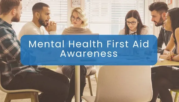 Group of diverse people participating in mental health awareness workshop.